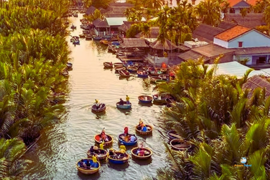 Tourists enjoy basket boat ride in Bay Mau Coconut Village Hoi An – Auasia Travel